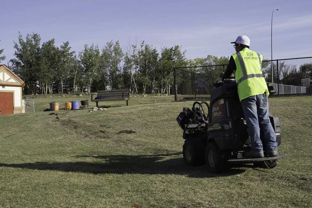 Line puller in use during underground sprinkler system installation to minimize digging naiad irrigation calgary alberta copy 1024x683