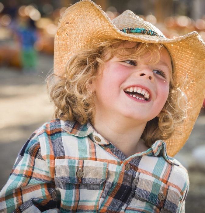 Boy wearing cowboy hat